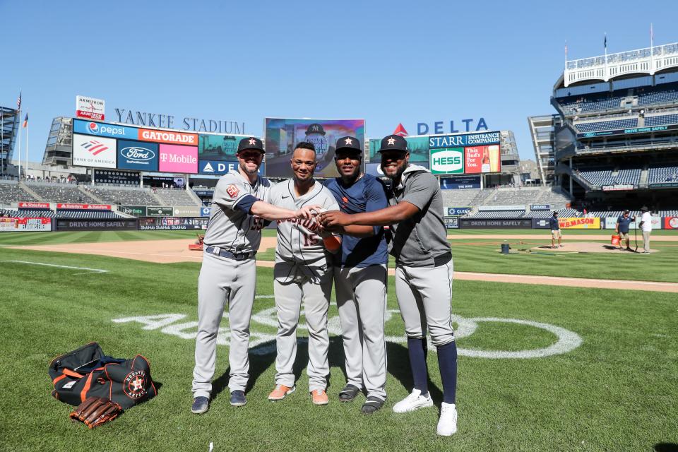 Ryan Pressly, catcher Martin Maldonado, Hector Neris and Cristian Javier pose for a photo after their combined no-hitter.